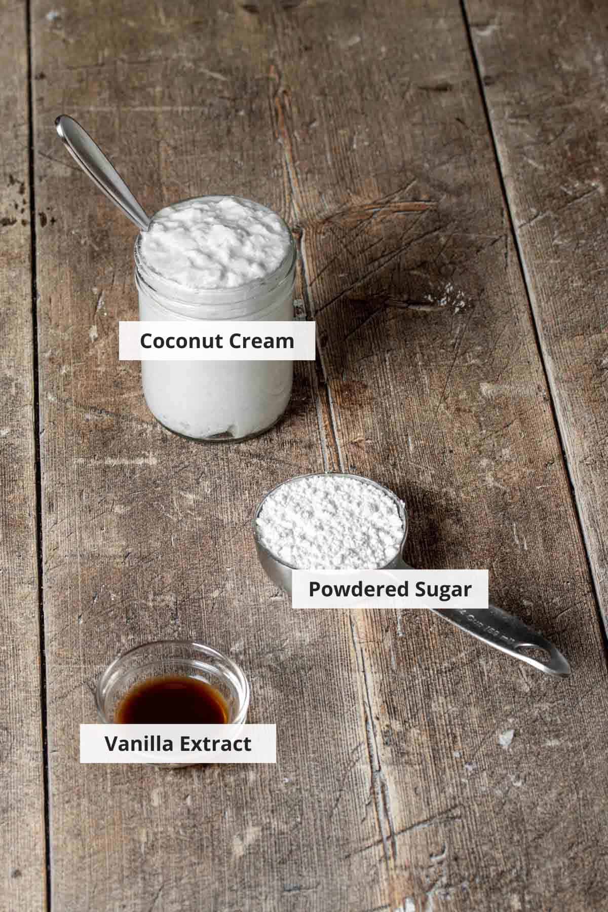 Ingredients for vegan whipped cream recipe on a wood background.