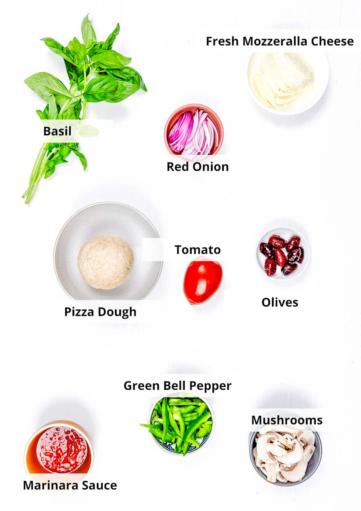 Ingredients for veggie supreme pizza recipe on a white background.