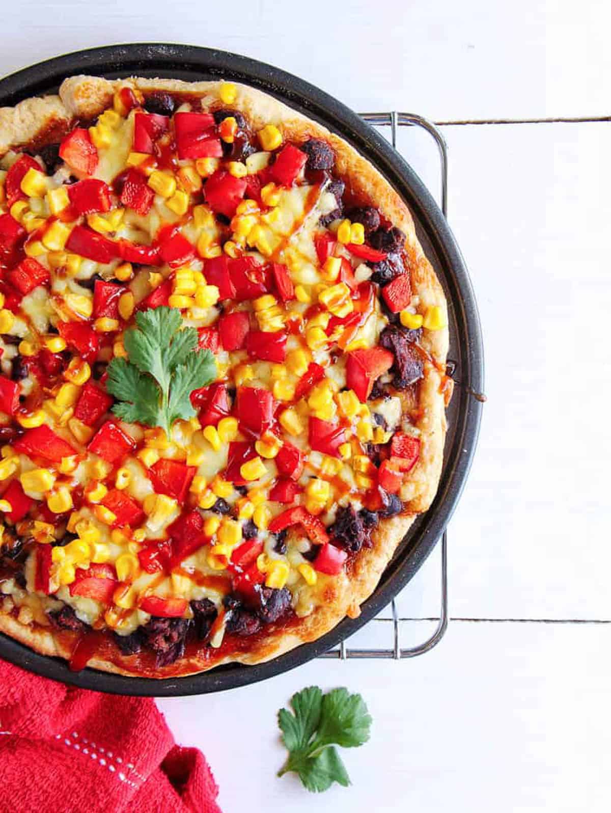 An overhead shot of a pan of bbq black bean flatbread