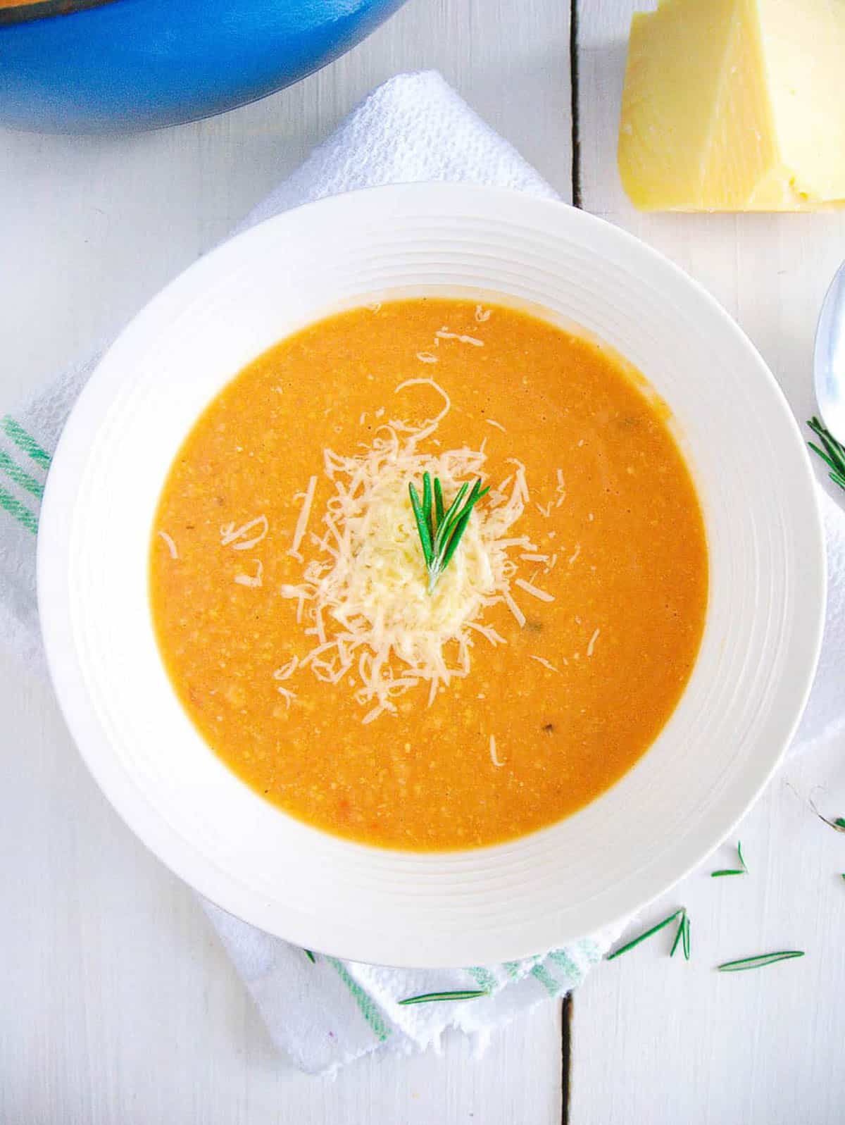 Overhead shot of a white bowl of creamy chickpea soup.