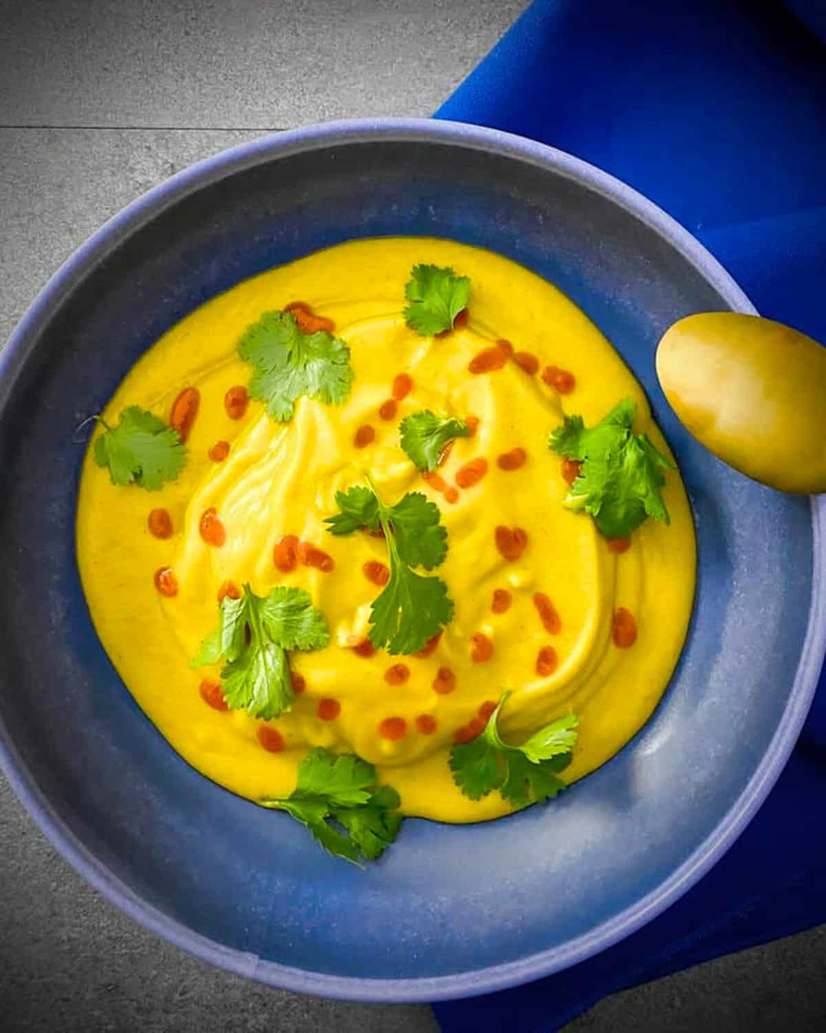 Overhead shot of a bowl of butternut squash and apple soup. 