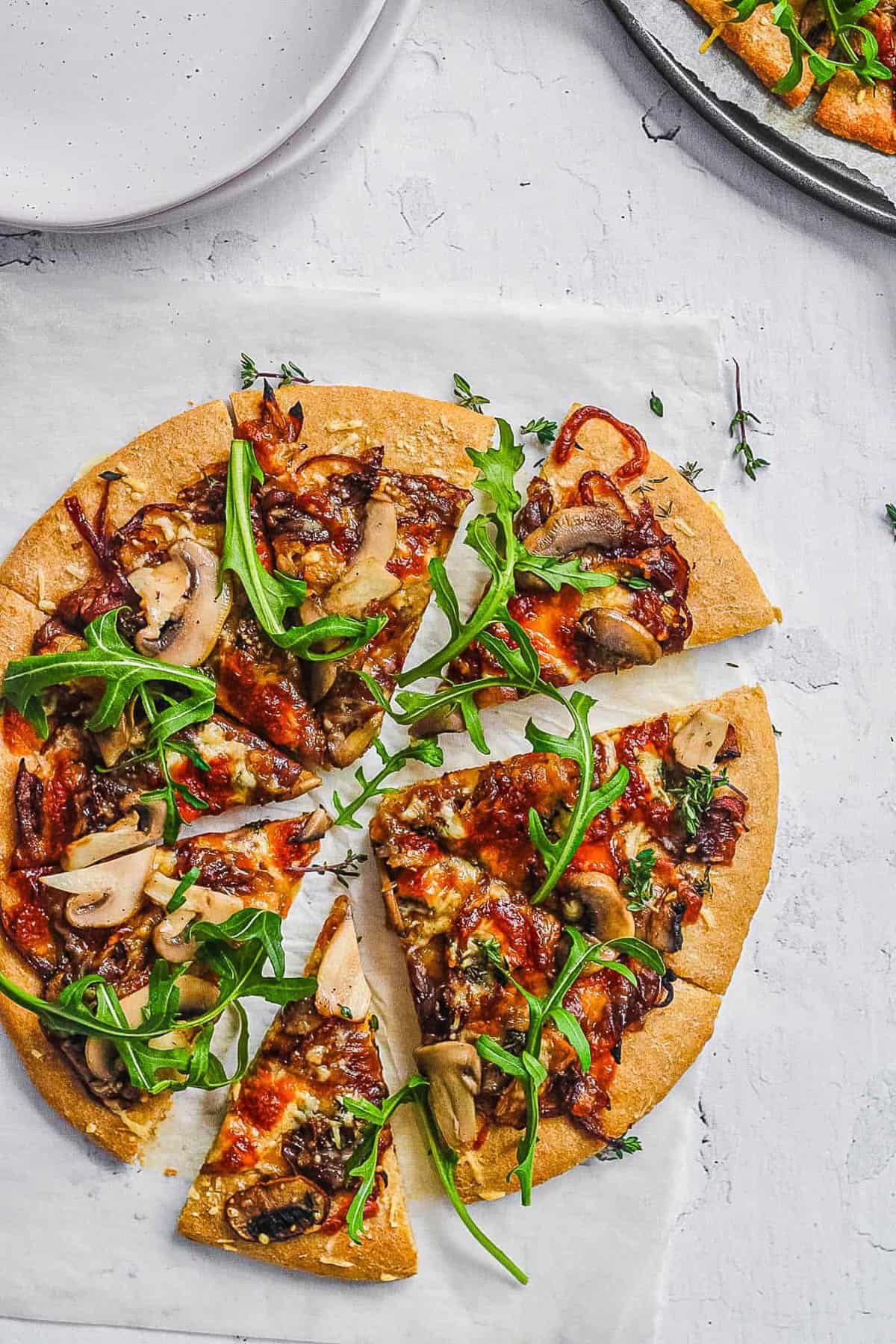 Overhead shot of a sliced rustic pizza.