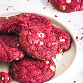 Easy red velvet cake mix cookies, stacked on a white plate.