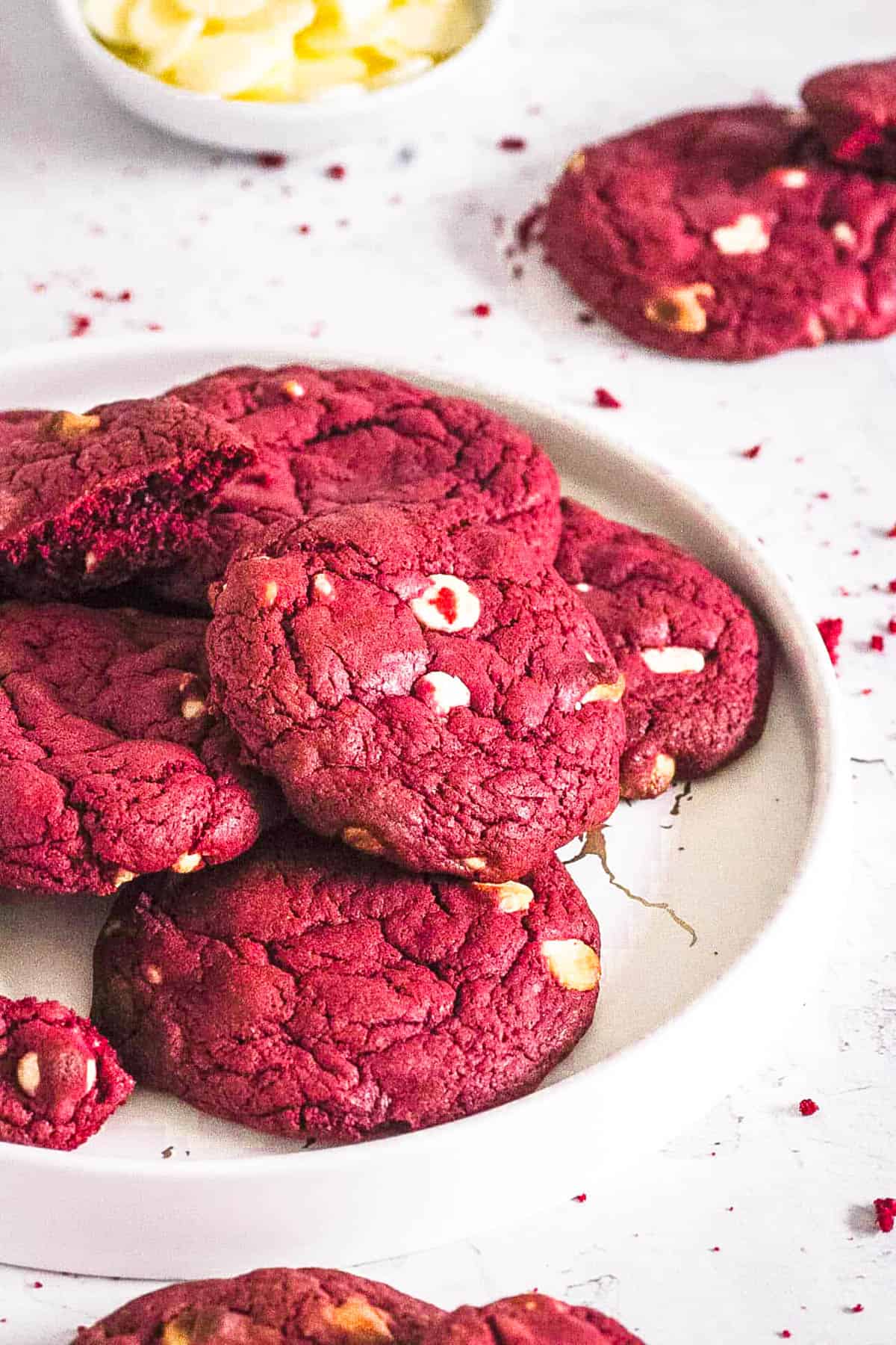 Easy red velvet cake mix cookies, stacked on a white plate.