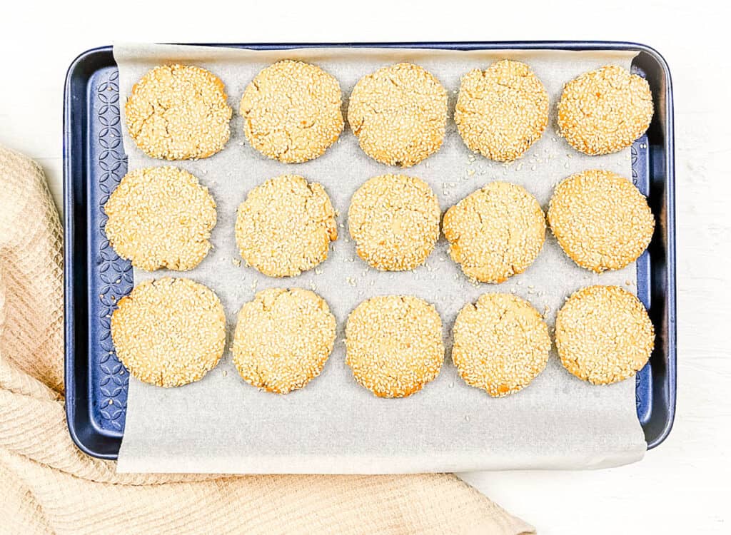 Tahini sesame cookies ready to be baked in the oven, arranged on a baking sheet.