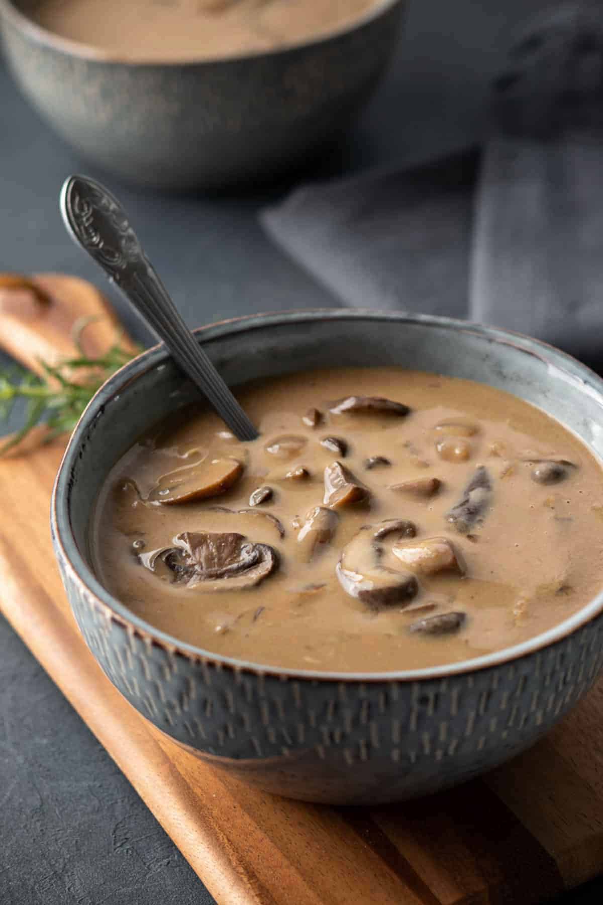 An angled shot of a bowl of vegan mushroom soup.