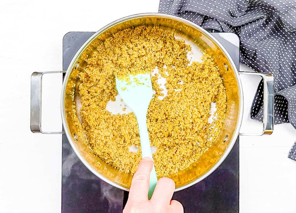Cooked quinoa in a large pot on the stove.
