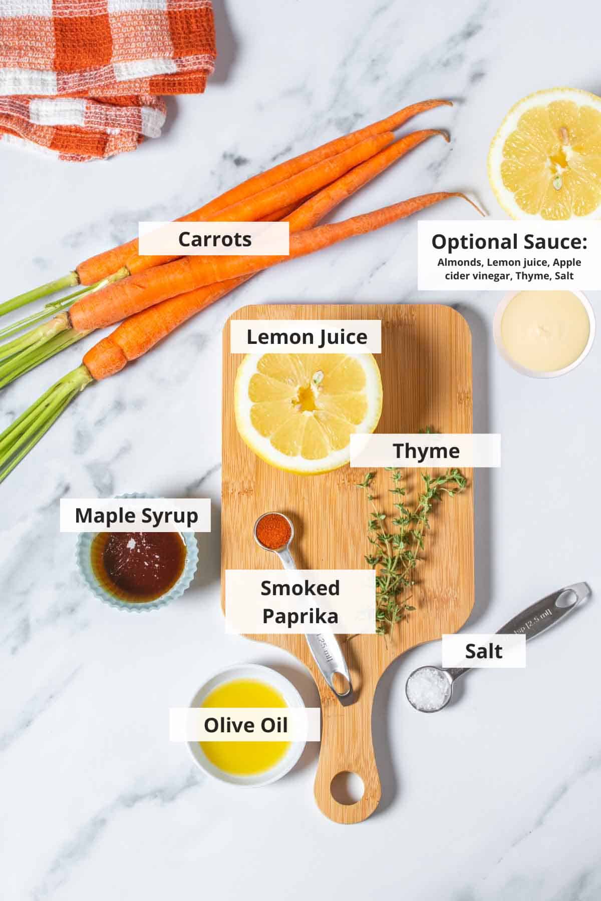 Ingredients for maple roasted carrots recipe on a white background.