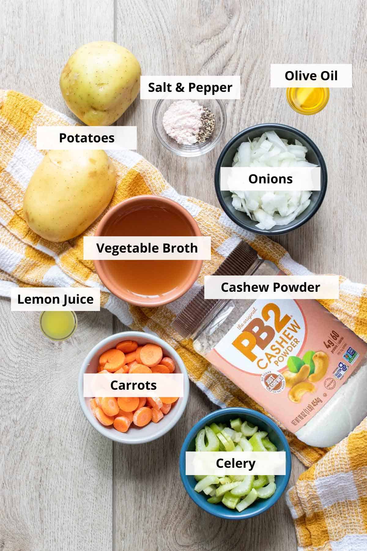 Ingredients for vegan baked potato soup on a wood background.