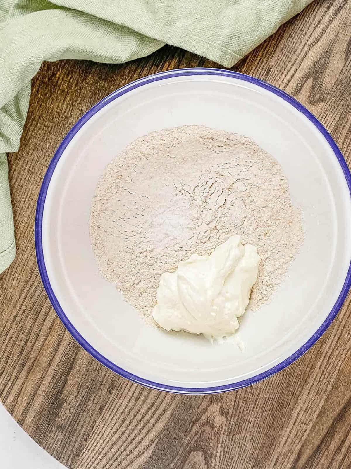A bowl a flour and Greek yogurt.