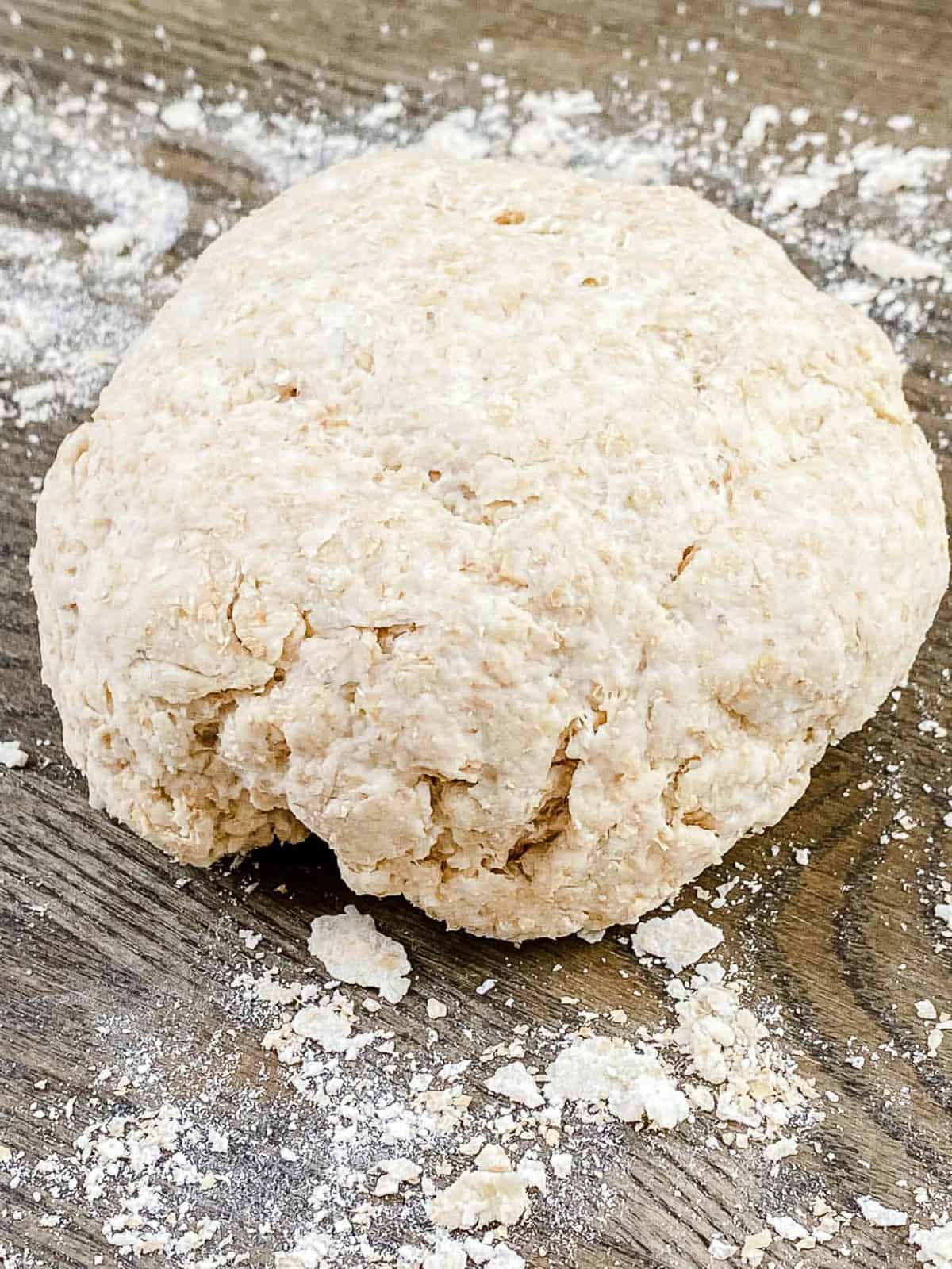 Kneaded dough formed in a round dough ball for low-calorie pizza crust.