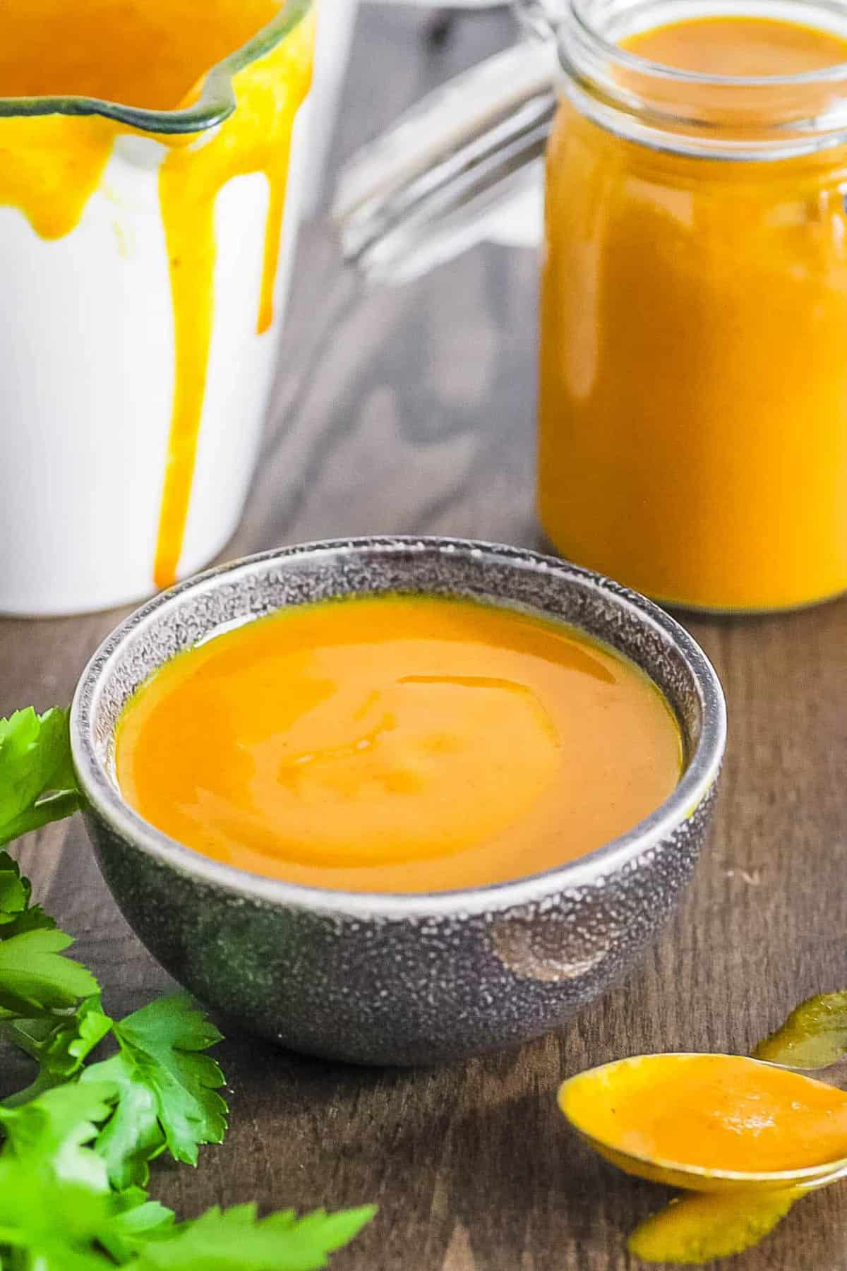 Carolina honey mustard bbq sauce served in a grey bowl.