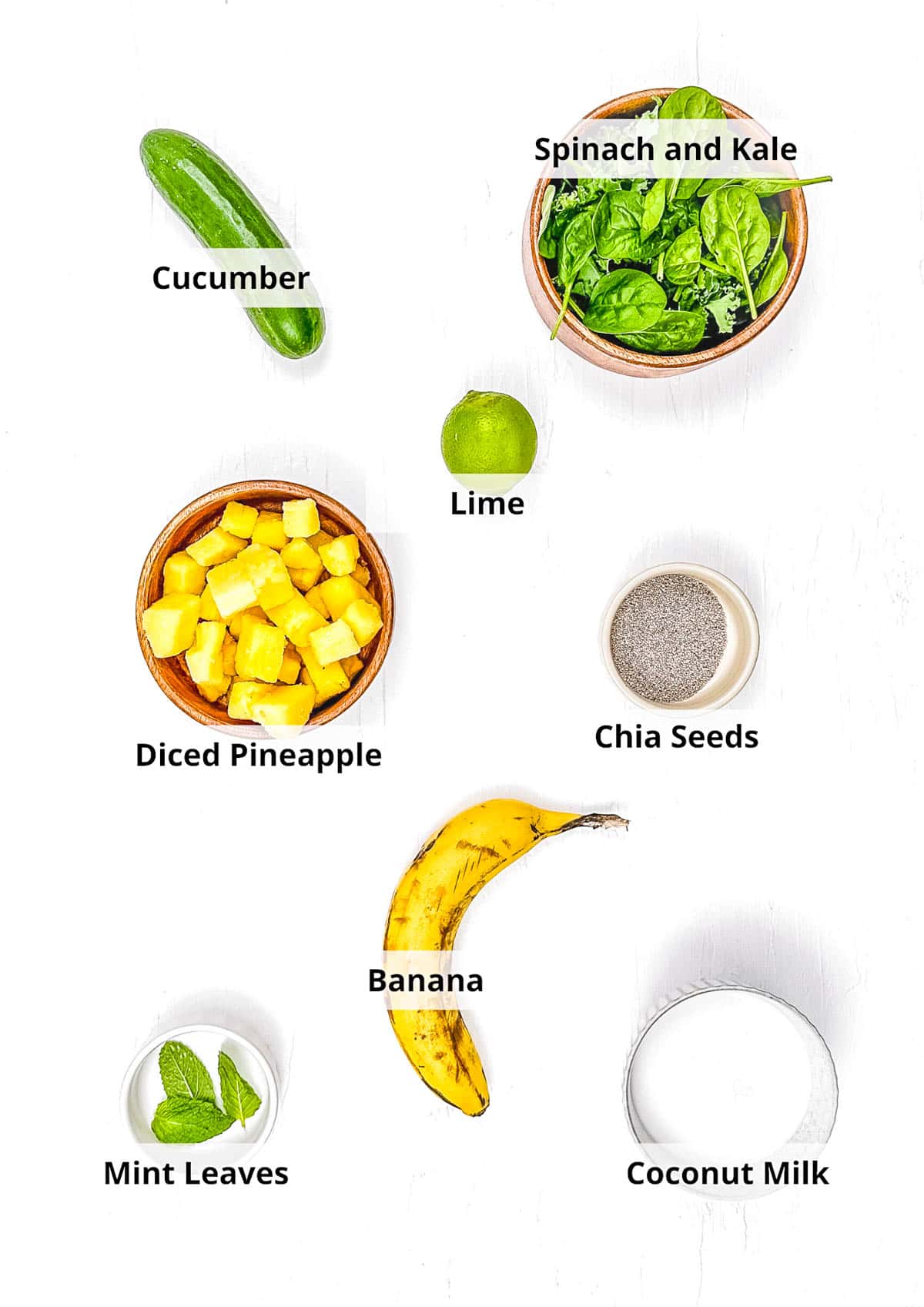Ingredients for pineapple cucumber smoothie recipe on a white background.