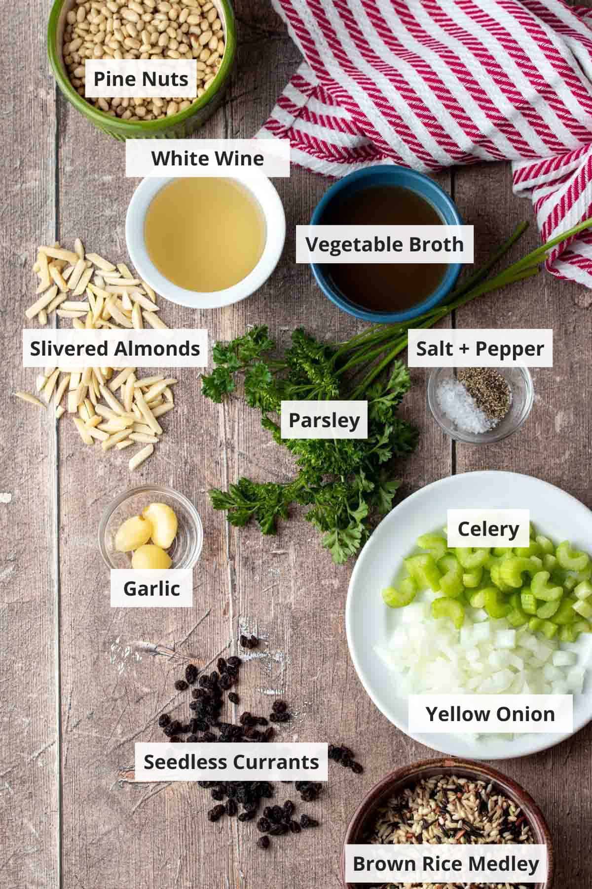 Ingredients for vegan rice stuffing recipe on a wood background.