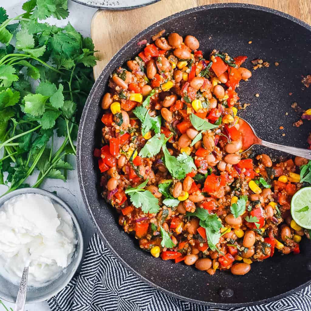 pinto bean casserole with veggies and quinoa in a pan