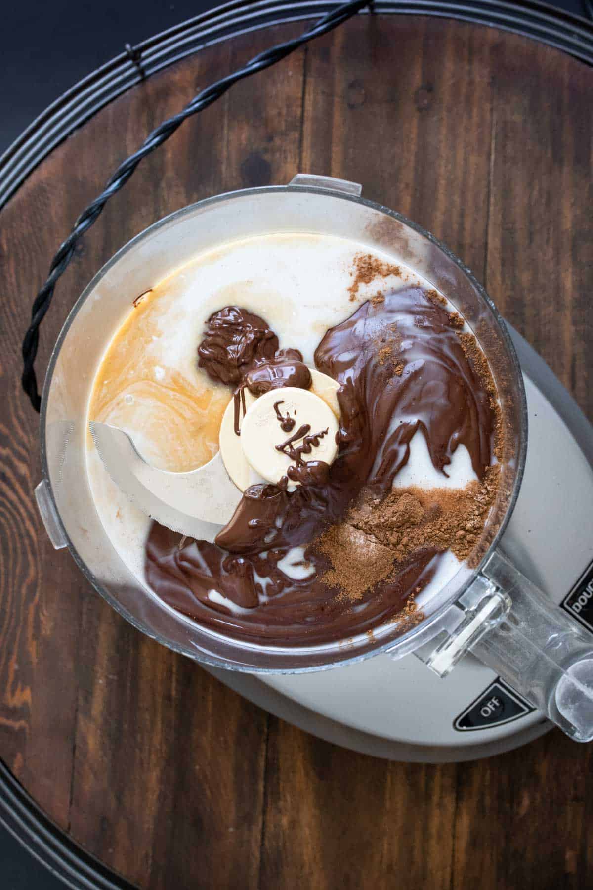 Different ingredients to make truffles in a food processor.