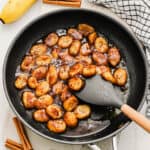 Caramelized bananas in a large skillet.