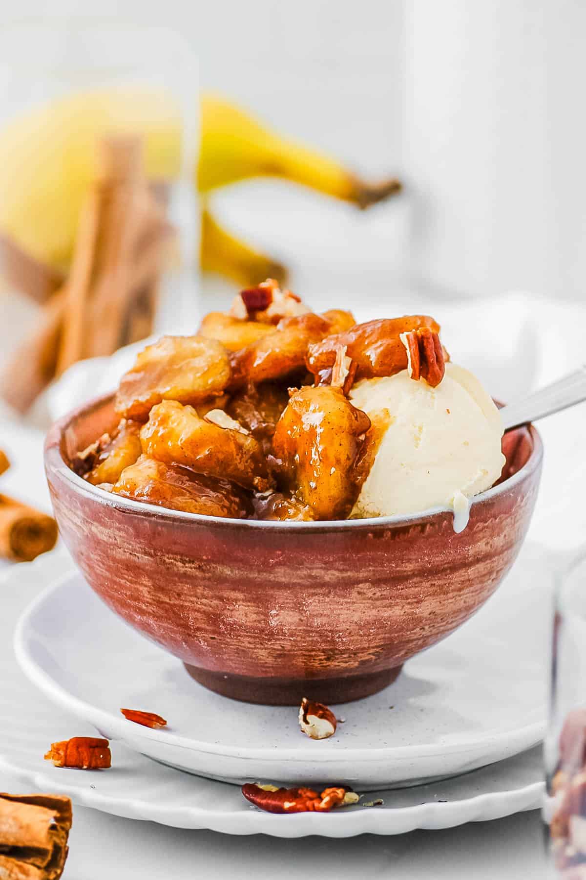 Caramelized bananas served with ice cream in a bowl.