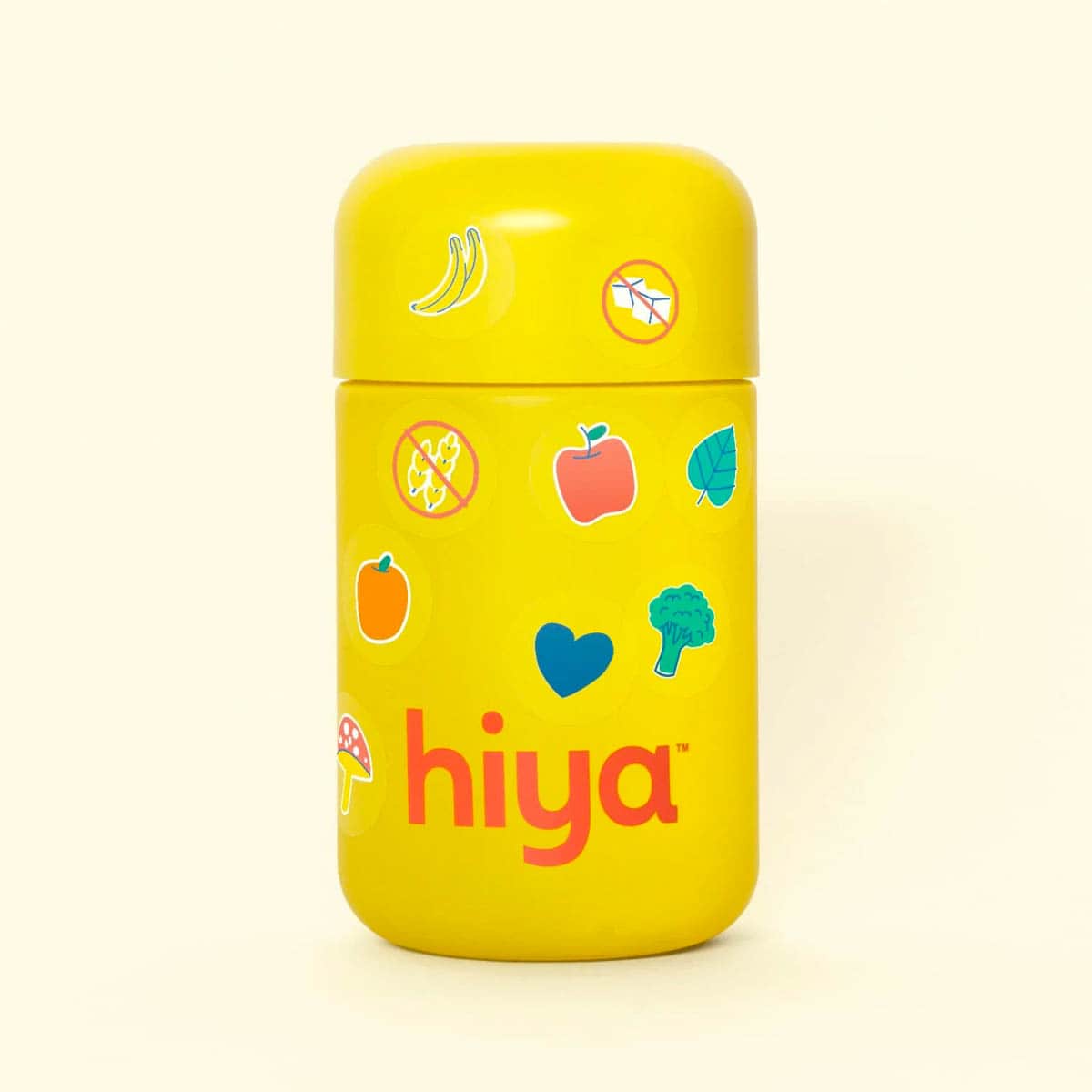 Bottle of Hiya kids vitamins on a yellow background.