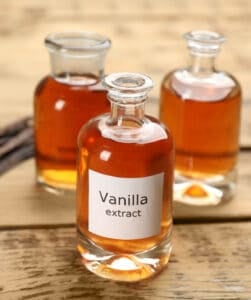 Homemade vanilla extract in glass jars.