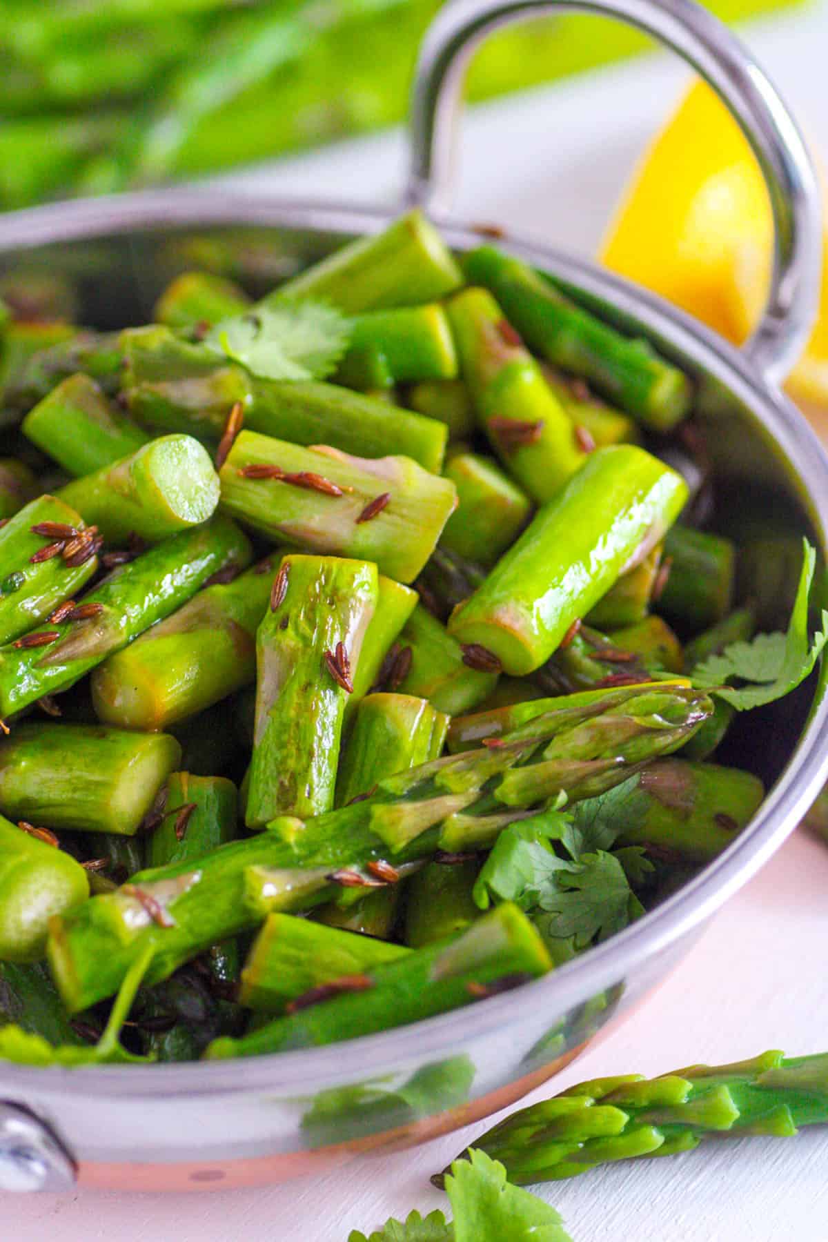 Indian asparagus sabji served in a stainless steel bowl.