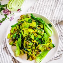 Indian bok choy stir fry served on a white plate.