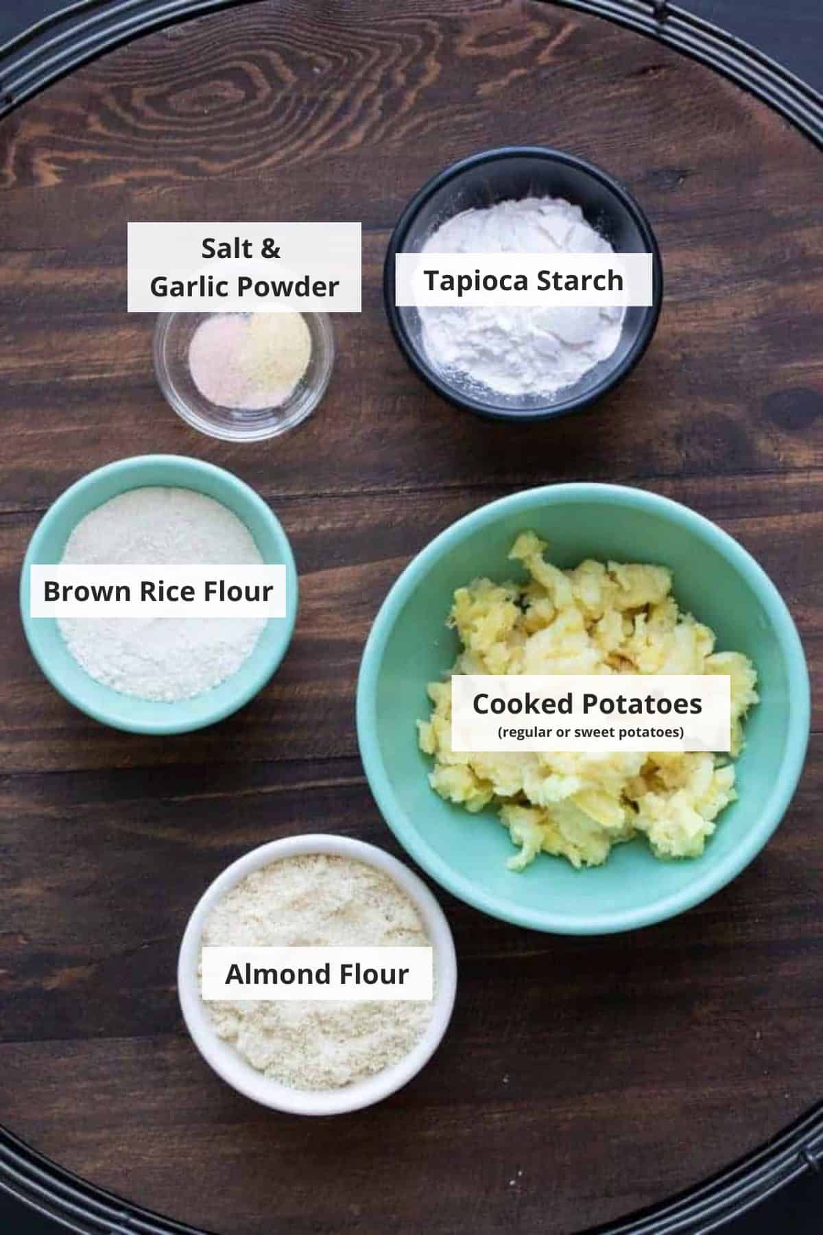 Ingredients for vegan gnocchi recipe on a wood background.