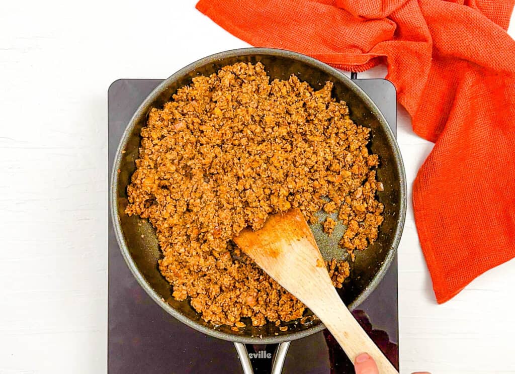 Vegan walnut meat for tacos, sauteeing in a pan.