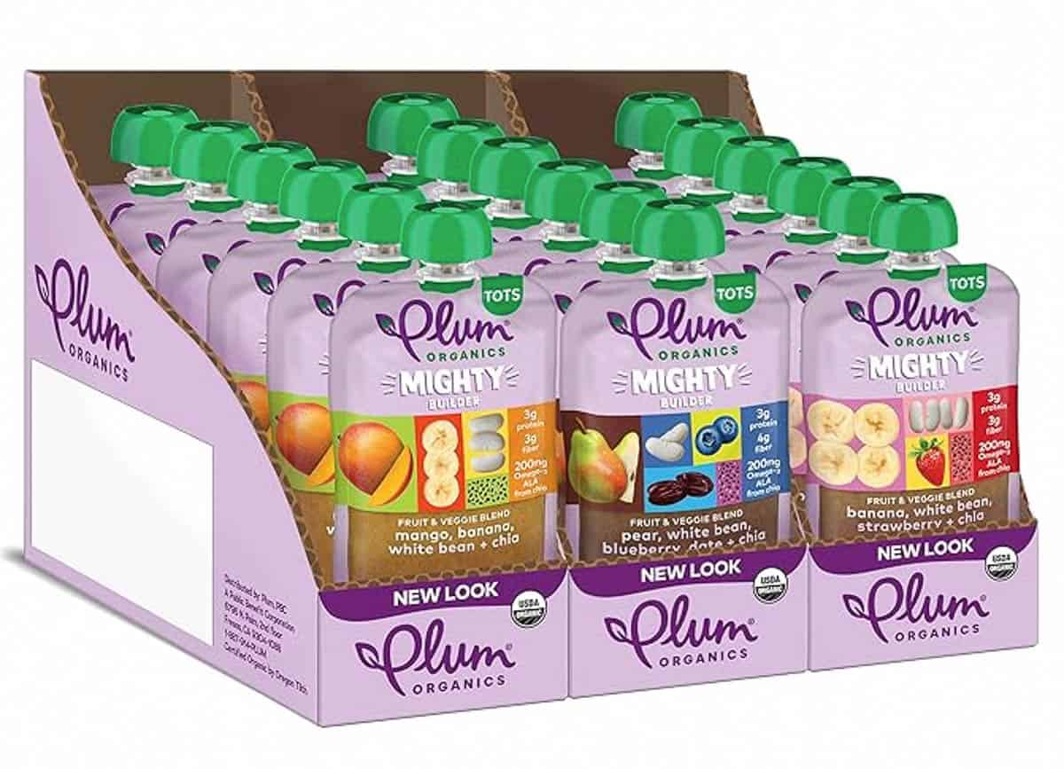 A pack of plum organic mighty builders on the counter.