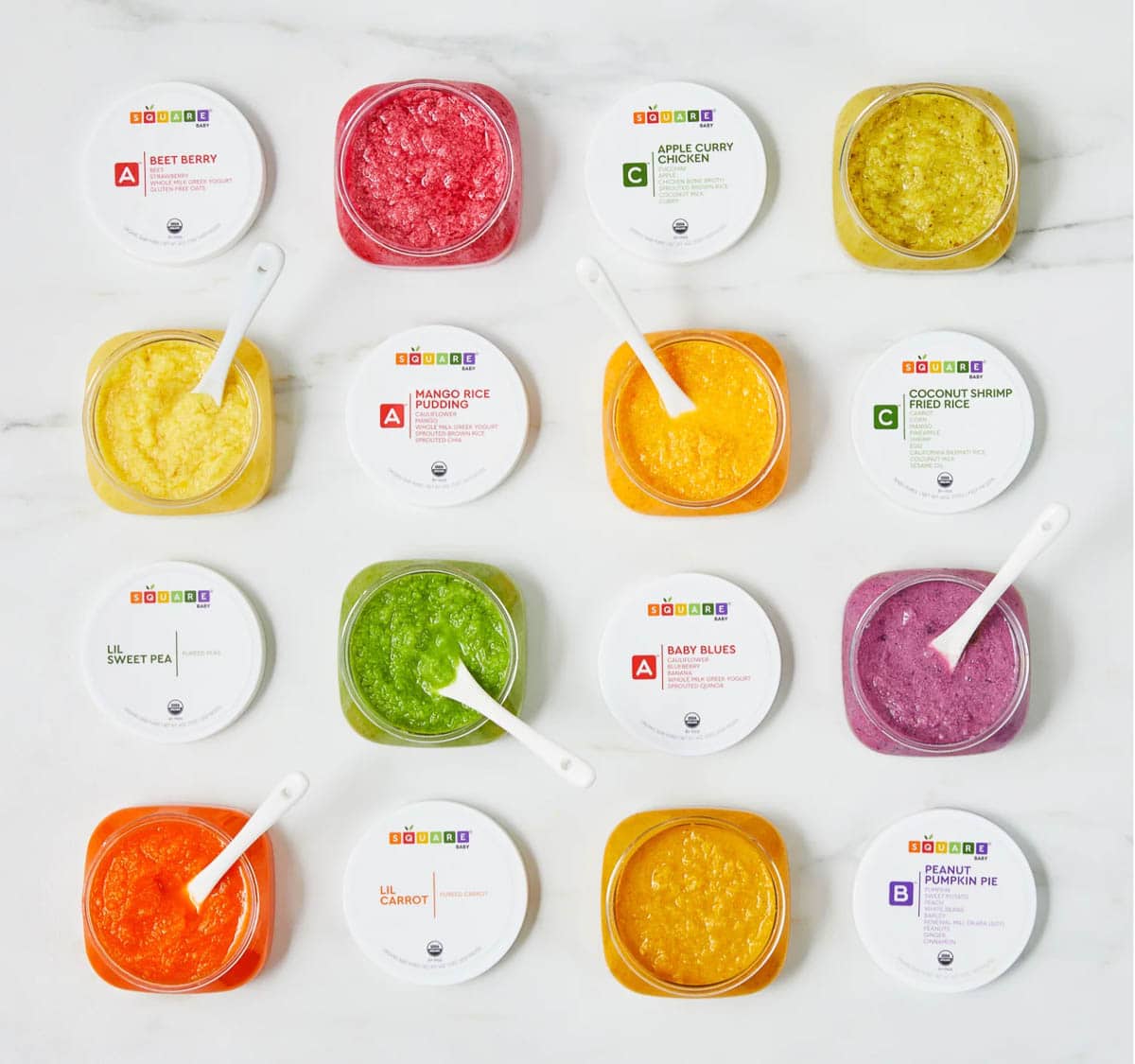 Open baby food containers with baby s،s.