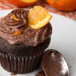 Chocolate orange frosting on a chocolate cupcake.