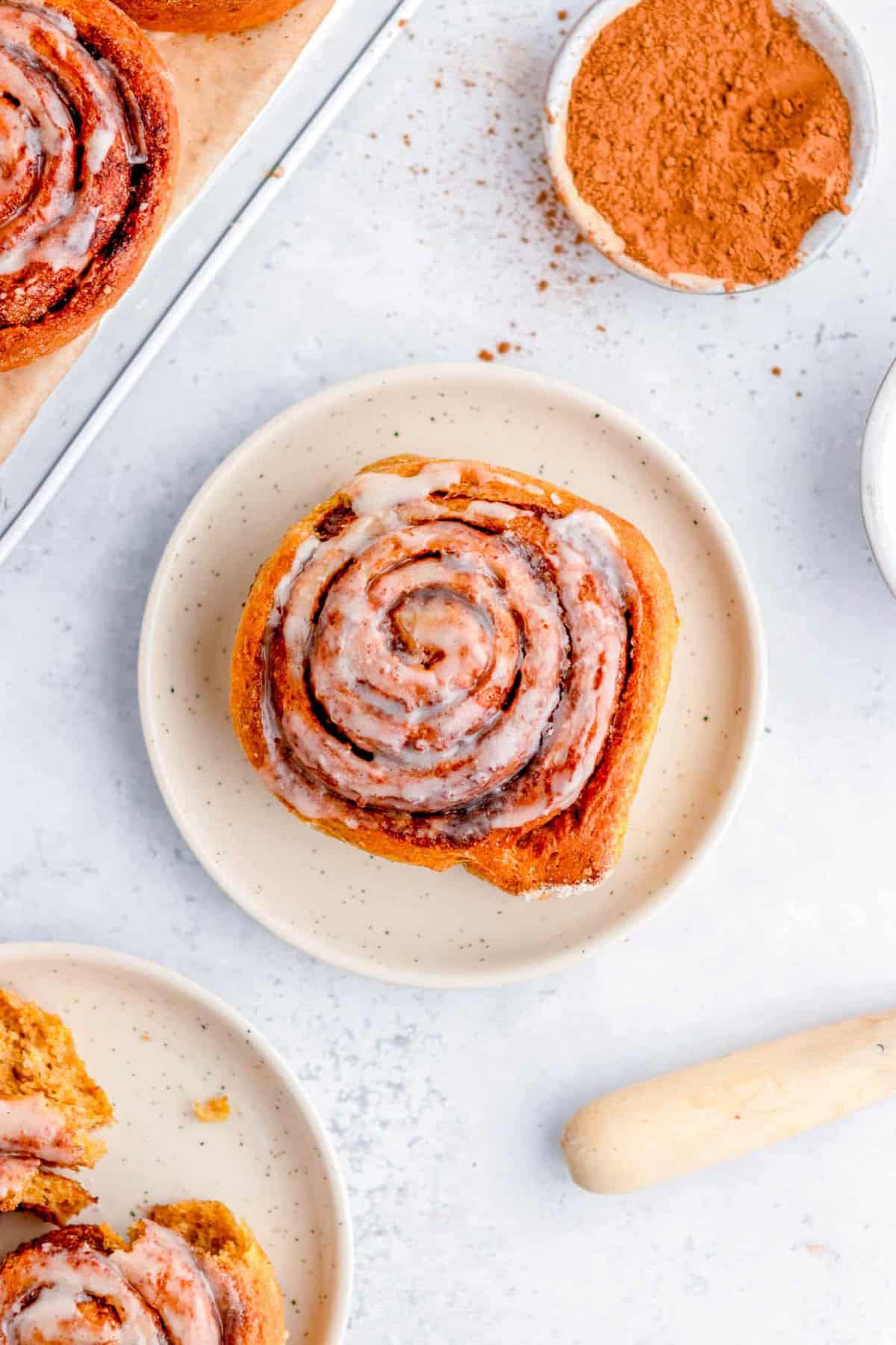 Healthy low calorie cinnamon roll served on a white plate.