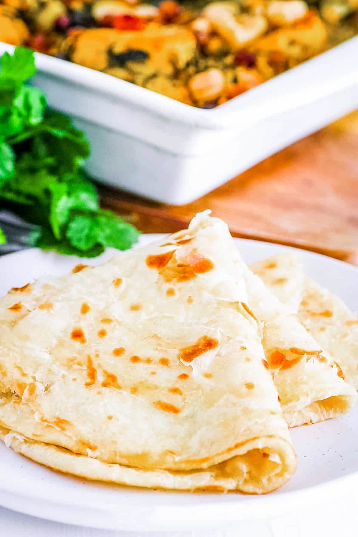 Authentic Guyanese roti served on a white plate.