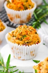 Savory vegetable muffins, served on a white plate.