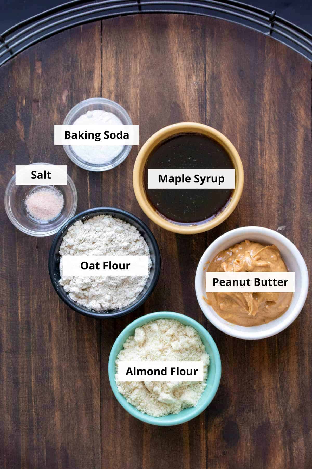 Ingredients for vegan gluten-free peanut butter cookies recipe on a wooden background.