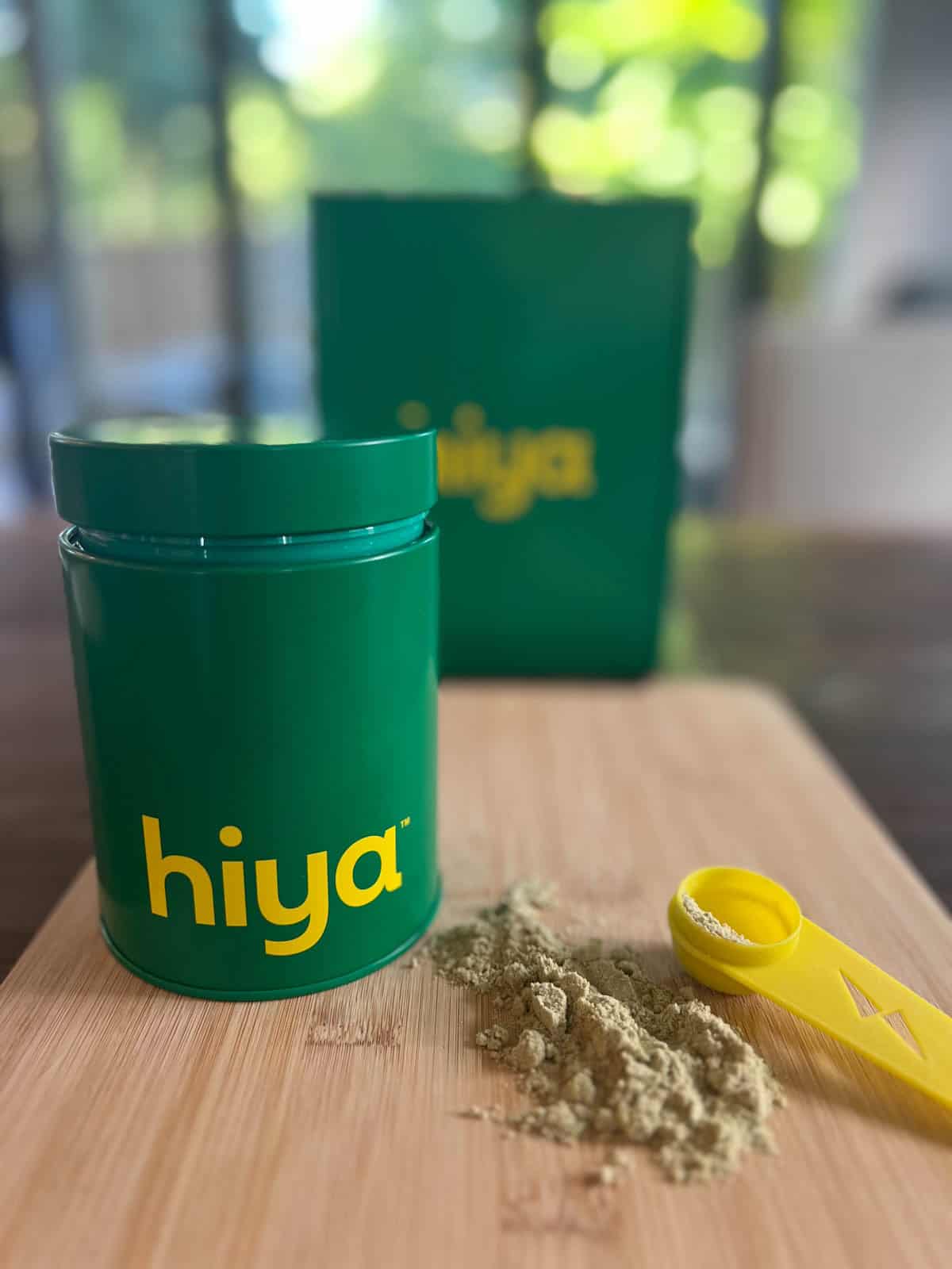 Scoop of Hiya vanilla greens on a cutting board next to the greens container.