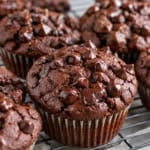 Chocolate sweet potato muffins cooling on a wire rack.