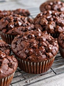 Chocolate sweet potato muffins cooling on a wire rack.