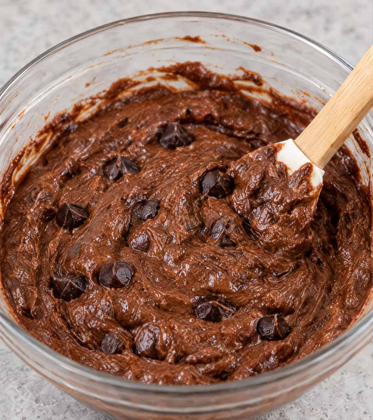 Batter for chocolate sweet potato muffins in a mixing bowl.